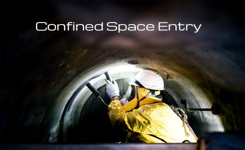 Worker in protective gear inside tunnel